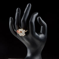 Side angle view highlighting the comfortable band silhouette of the luxury orange flower crystal ring