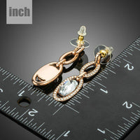 oval chain link crystal drop earrings detail view by KHAISTA