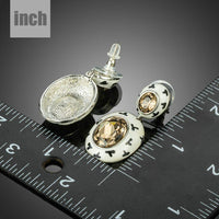 oval crystal pave drop earrings detail view by KHAISTA
