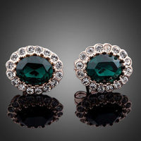 Side angle view of KHAISTA oval ellipse CZ stud earrings