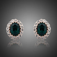 KHAISTA oval ellipse CZ stud earrings on white background
