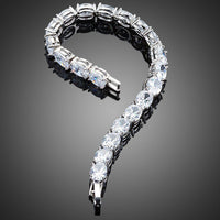 Close up detail of KHAISTA oval CZ tennis bracelet