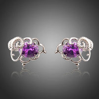KHAISTA oval purple CZ stud earrings on white background