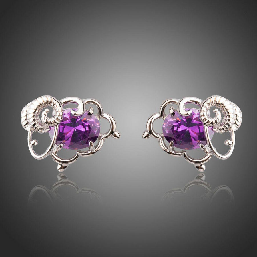 KHAISTA oval purple CZ stud earrings on white background