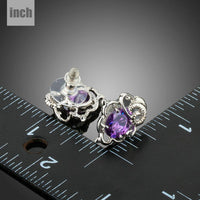 oval purple CZ stud earrings detail view by KHAISTA