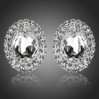 KHAISTA oval silver CZ stud earrings on white background