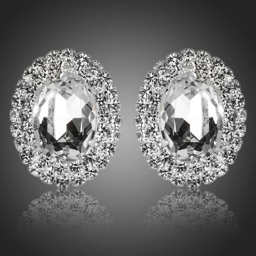 KHAISTA oval silver CZ stud earrings on white background