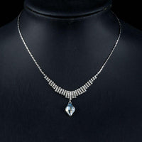 Side angle view of KHAISTA party wear waterdrop crystal pendant necklace