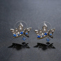 paved blue CZ crown stud earrings detail view by KHAISTA