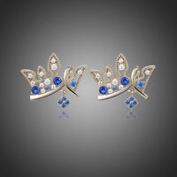 KHAISTA paved blue CZ crown stud earrings on white background