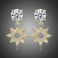 KHAISTA paved CZ crystal flower drop earrings on white background