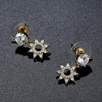 paved CZ crystal flower drop earrings detail view by KHAISTA