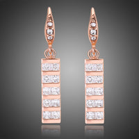 KHAISTA paved square cut rectangle drop earrings on white background