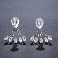 KHAISTA crystal paw design drop earrings on white background