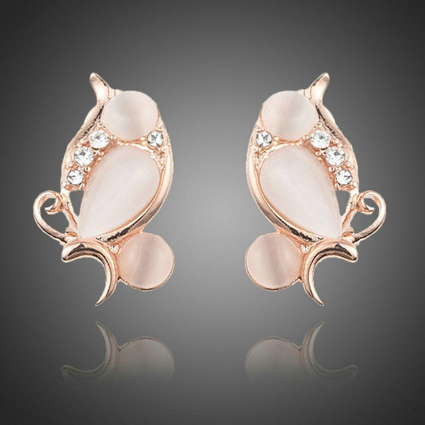 KHAISTA peach crystal clip earrings on white background