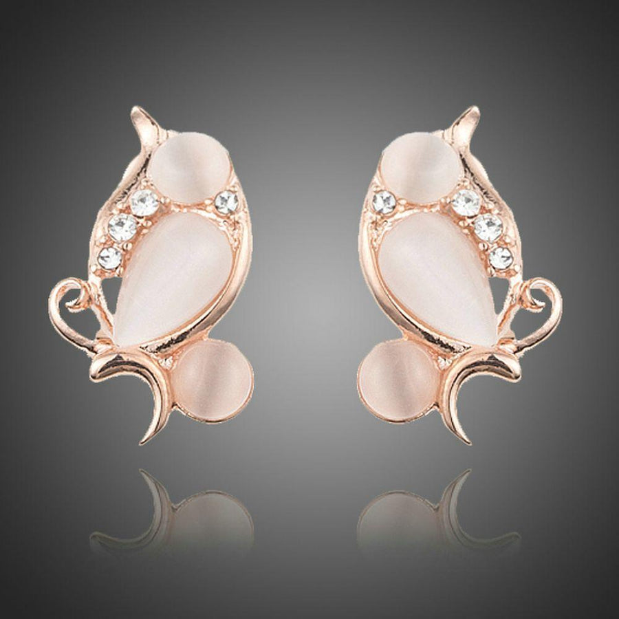 KHAISTA peach crystal clip earrings on white background