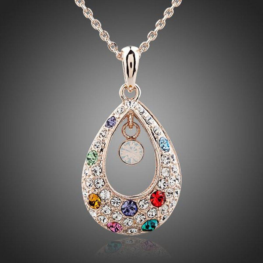 KHAISTA peacock tears crystal pendant necklace on white background