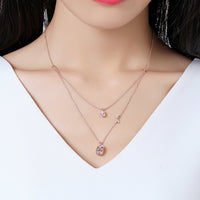 Close up detail of KHAISTA clear pear cut CZ necklace