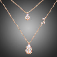 KHAISTA clear pear cut CZ necklace on white background