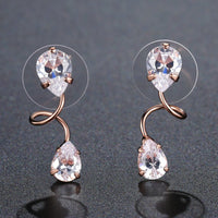 KHAISTA pear cut CZ drop earrings on white background