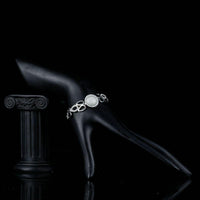 Side angle view of KHAISTA pear cut opal crystal bracelet