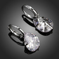 Close up of KHAISTA pear shaped CZ drop earrings