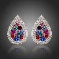 KHAISTA pear shaped CZ stud earrings on white background
