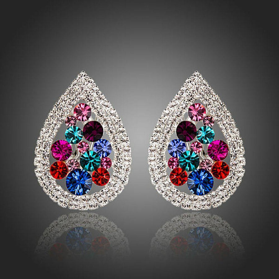 KHAISTA pear shaped CZ stud earrings on white background