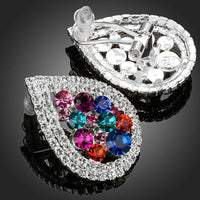 Close up of KHAISTA pear shaped CZ stud earrings