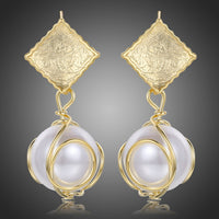 KHAISTA pearl drop earrings for women on white background