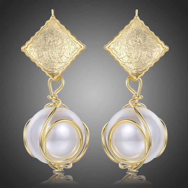 KHAISTA pearl drop earrings for women on white background