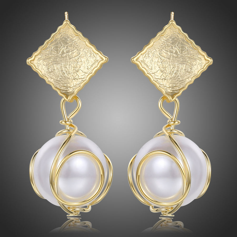 KHAISTA pearl drop earrings for women on white background