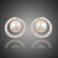 KHAISTA pearl eyeball stud earrings on white background