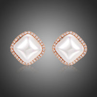 KHAISTA pearl geometric stud earrings on white background
