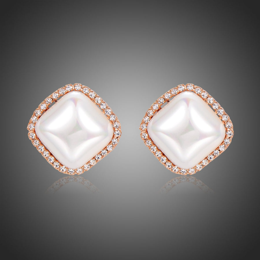 KHAISTA pearl geometric stud earrings on white background