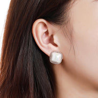 pearl geometric stud earrings detail view by KHAISTA