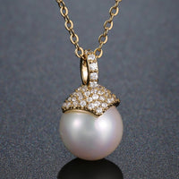 Pendant detail on KHAISTA pearl round cut CZ pendant necklace