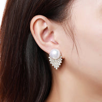 Side angle view of KHAISTA pearl stud earrings for women