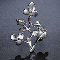 Side angle view of Khaista pearl plum blossom brooch