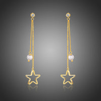 KHAISTA pentagram crystal drop earrings on white background