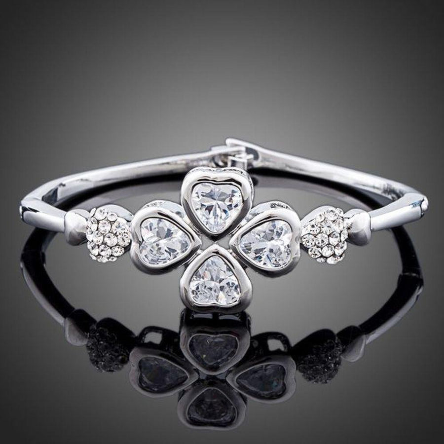 KHAISTA crystal petal bangle bracelet on white background