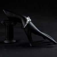 Side angle view of KHAISTA crystal petal bangle bracelet