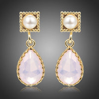 KHAISTA pink opal crystal drop earrings on white background