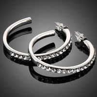 KHAISTA platinum plated bangle design drop earrings on white background