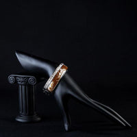 Side angle view of KHAISTA platinum plated caramel crystal cuff