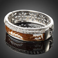 Close up detail of KHAISTA platinum plated caramel crystal cuff