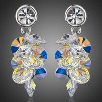 KHAISTA platinum plated crystal cluster drop earrings on white background