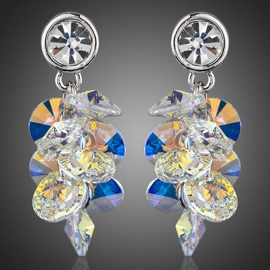 KHAISTA platinum plated crystal cluster drop earrings on white background