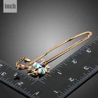 Pendant detail on KHAISTA plum blossom branch pendant necklace