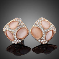 KHAISTA popping eyes emoji crystal stud earrings on white background